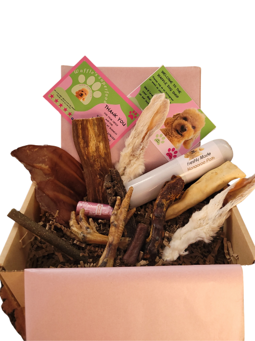 full box of natural dog treats with pate